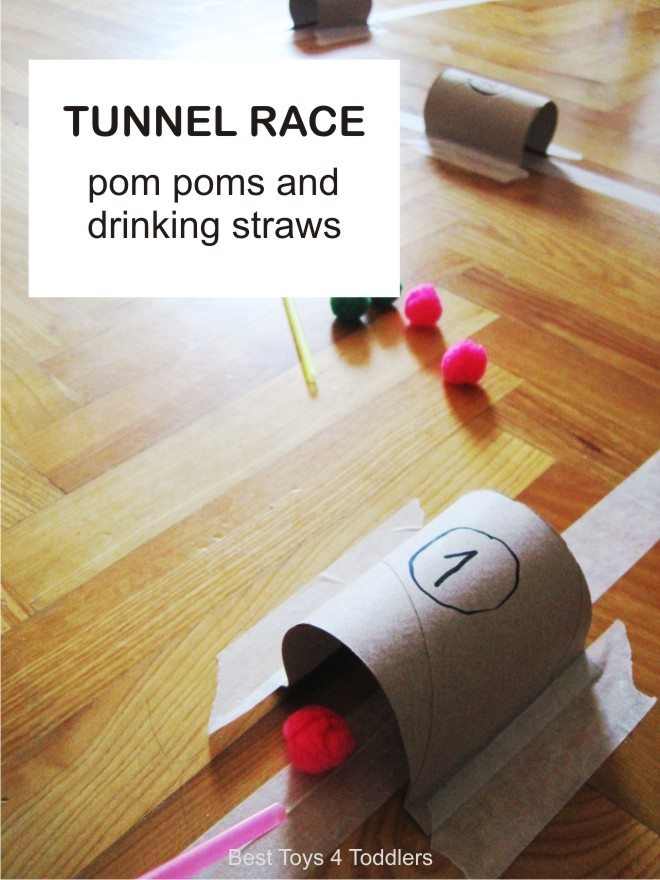 Simple tunnel race game with pom poms and drinking straws. Kids had fun trying to blow pom poms through the tunnels and keeping them on the path.